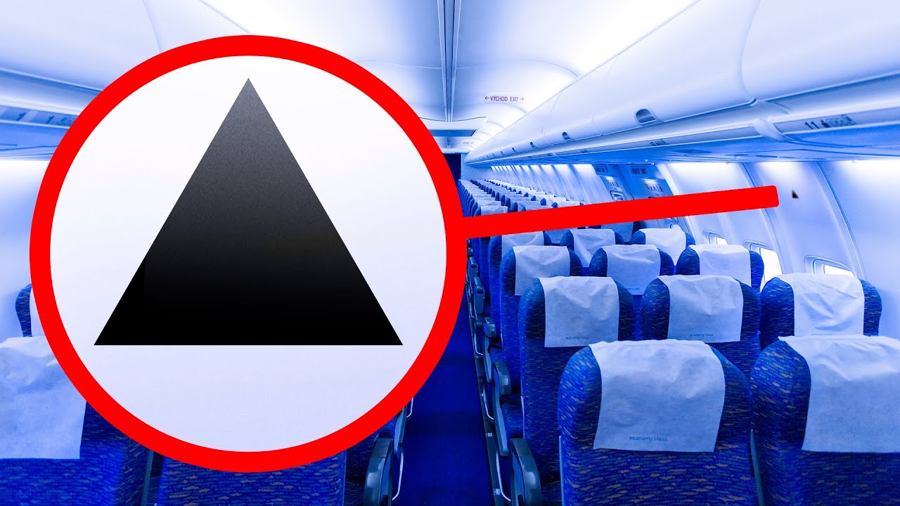Τι σημαίνει το μικροσκοπικό τρίγωνο πάνω από τις θέσεις στο αεροπλάνο
